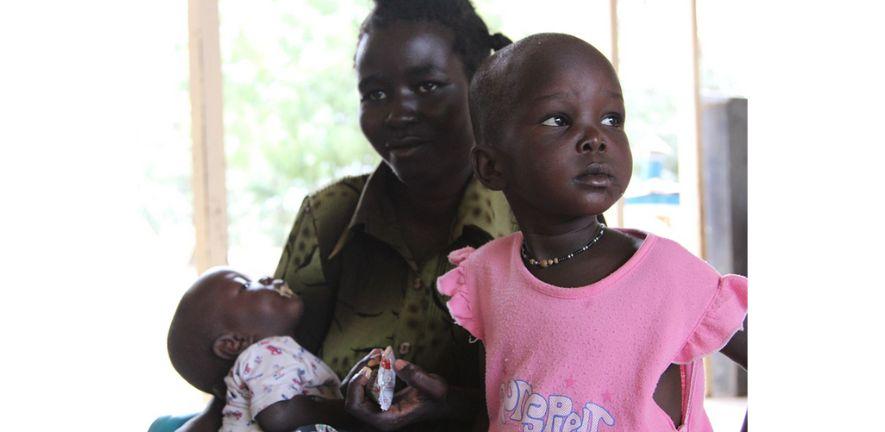 Eveline Erupe with her two daughters who are four and 10 months. Eveline has brought them to Lodwar District Hospital to the outpatient unit. Picture credit: Marisol Grandon/Department for International Development Eveline Erupe with her two daughters who are four and 10 months.Picture credit: Marisol Grandon/Department for International Development