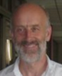 Smiling man with a grey beard