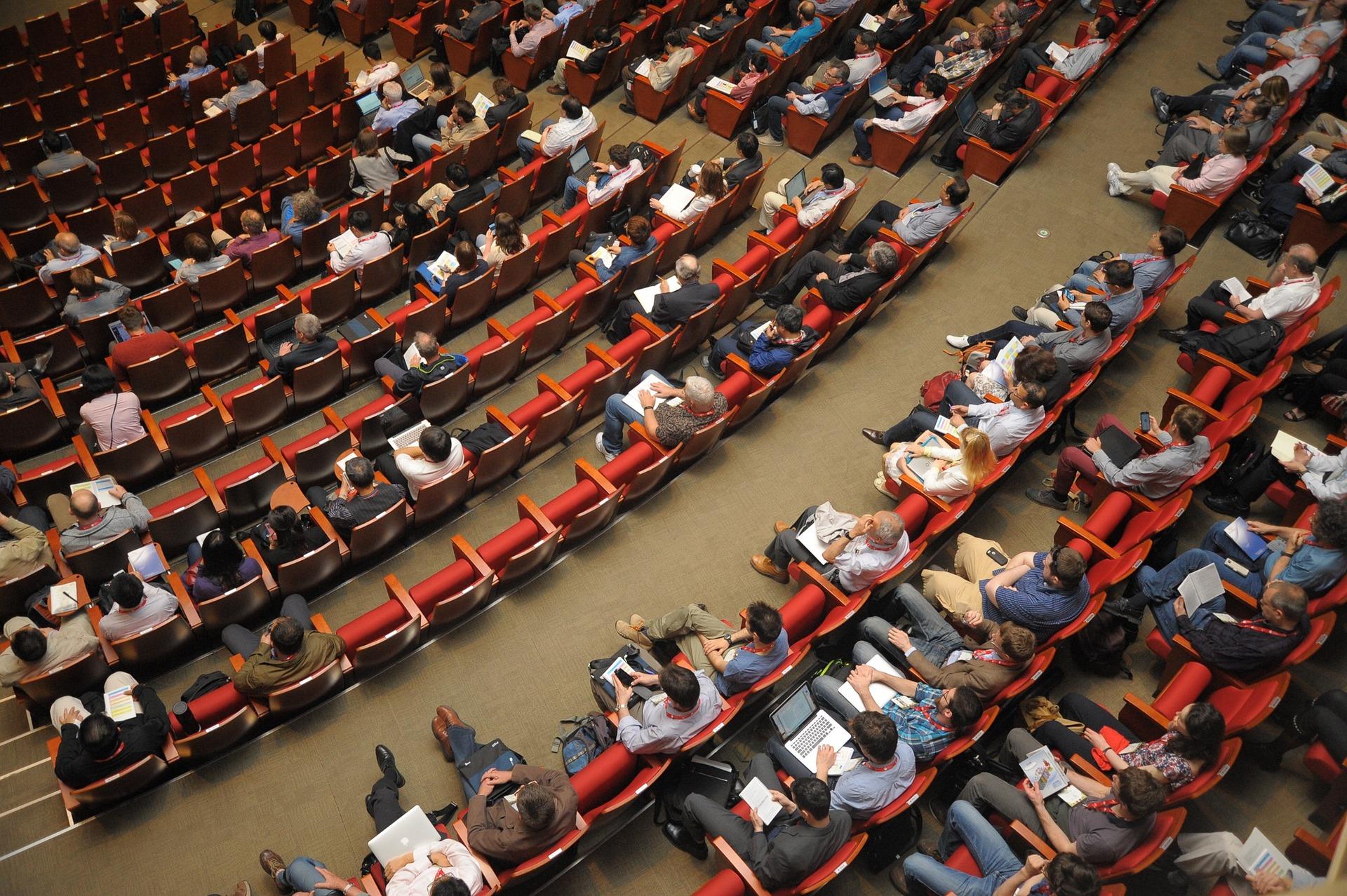 Ariel view of people sitting in an auditorium